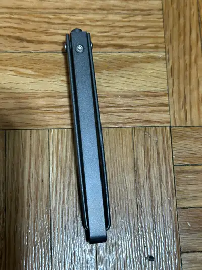 This M390 steel blade balisong knife is a high-quality, precision-crafted tool that is in good condi...