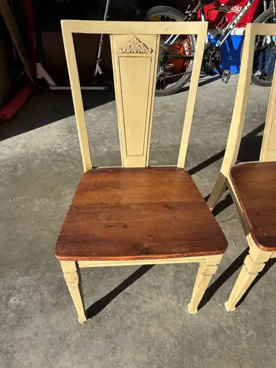 Set of 4 vintage wooden chairs. The lighting is making them look yellowish but they are creamy beige...