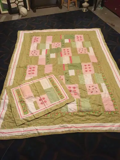 Beautiful twin quilt-like bedding with sham. Clean, and smoke free home. Asking $30.00