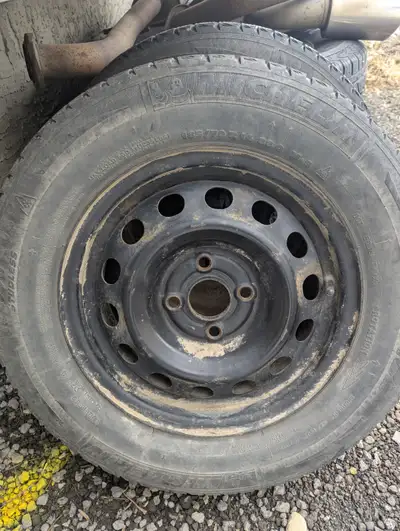 2 steel wheels from 2001 Civic. Tires on them currently Michelin X Ice 185/70R14 but well worn 4x100...