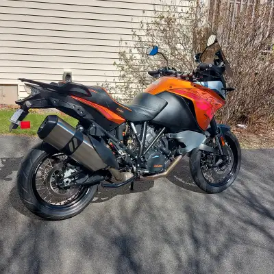 Like new 1190 KTM Adventure Motorcycle with 5000 kms on clock. Custom seat, bars, wind screen. KTM o...