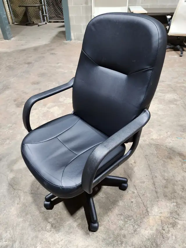 Black leatherette high-back office chair — rolls, swivels, adjus
