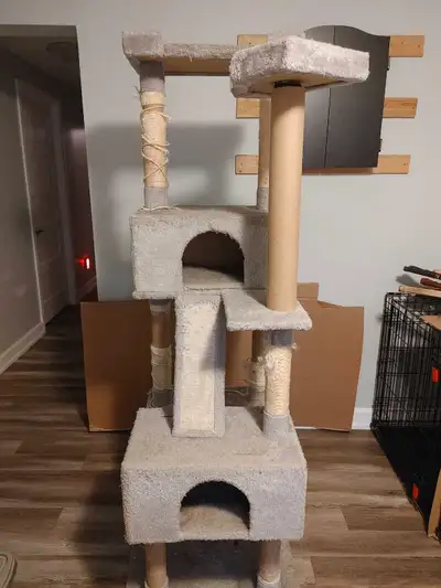 This cat tower is the purr-fect playground for your feline friend, featuring multiple levels for cli...