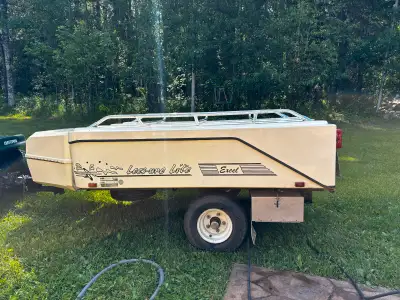 2009 Lees-ure lite trailer. Blue in colour; like new condition, has optional deluxe add a room, opti...