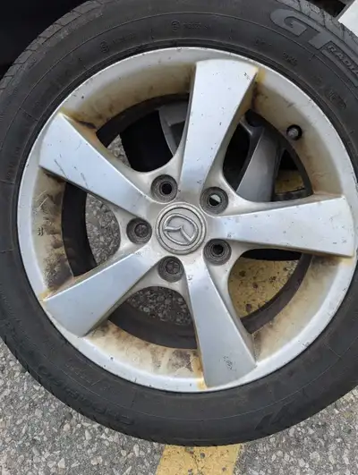 Selling rims with tires on them. The tires are old so drive on them at your own risk.
