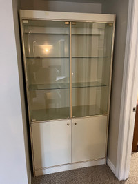 Off-white display cabinet with glass doors and shelves 