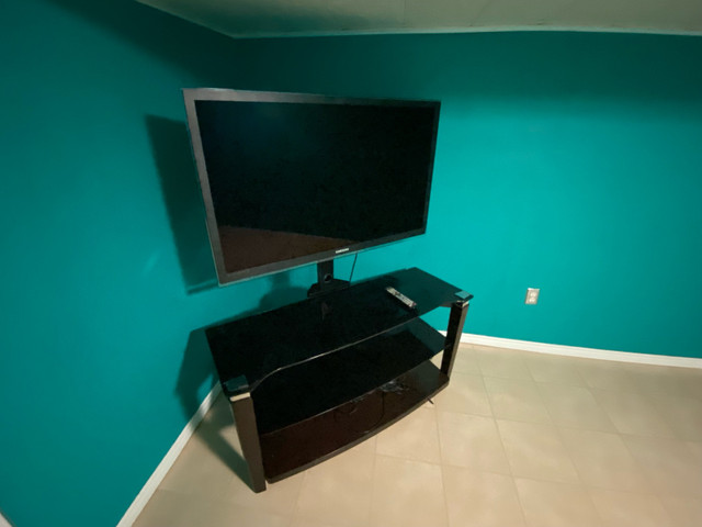 Samsung TV and stand in TVs in Hamilton