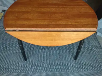 ROUND WOODEN DINING TABLE WITH TWO DROP LEAFS, View more