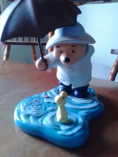 Winnie the Pooh Bear in the rain, retired figurine, caption reads: "We'll Share Forever, Whatever th...
