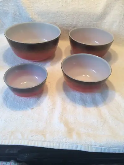 FIRE KING 4 MIXING BOWLS 2 TONE BLACK AND ORANGE