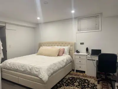 Welcome to this bright and spacious 2-bedroom, 2-bathroom walkout basement apartment located in a hi...