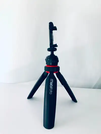 A compact tripod designed for smartphones. Includes a Bluetooth remote. You can set it up in your fa...