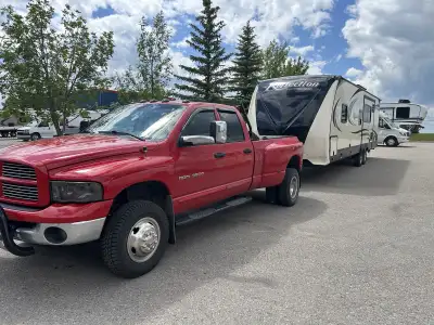 2005 Dodge Ram 3500 (Dually) 5.9L Cummins. Laramie with a manual 6 speed transmission. Aftermarket e...