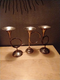 Vintage brass horn themed candle holders.