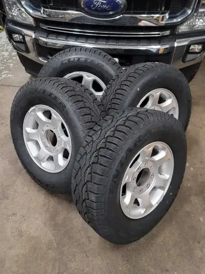 8-bolt 17" stock Ford F-250 / F-350 Super Duty rims with brand new studdable winter tires. Rims are...