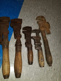 Vintage set of pipe wrenches with wooden handles