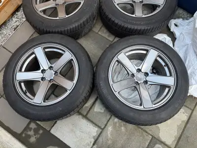 Selling a staggered set of 18-inch Continental winter tires mounted on rims. • Front tires: 235/60R1...