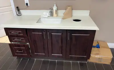 vanity countertop with whole garbage beside , View more