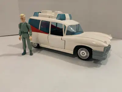 Vintage Ecto-1 with vintage Egon figure. Comes as show with replacement aftermarket stickers for Ect...