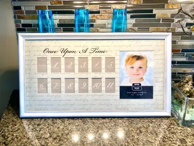 Adorable picture frame with slots for each of your child’s first 12 months of life.. plus one additi...