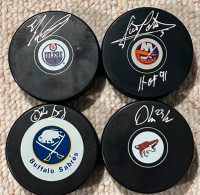 Signed pucks with coa’s