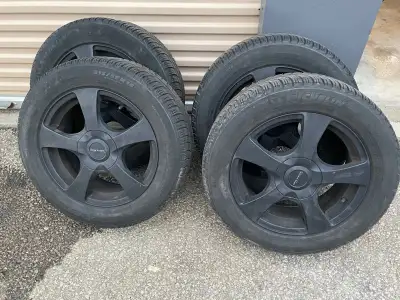 Set of 4 Michelin X ice snow tires size 215/55R16 with Core Racing Lizea black alloy rims. Used on H...