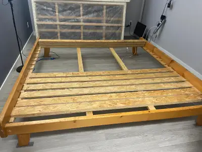 King size bedframe solid pine needs a little bit of work nothing serious great deal come check it ou...