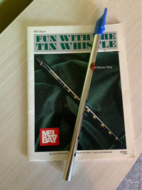 Blue b flat tin whistle with instruction book