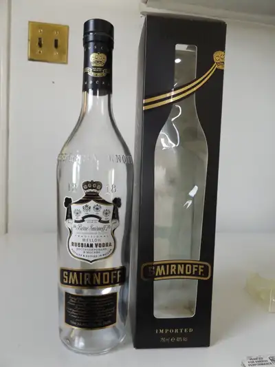 This is an original vintage empty Smirnoff vodka bottle. This Smirnoff is the Black issue with the o...