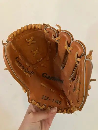 Left hand glove not damage The gamma is larger Rawlings is 9 inches It would fit a child Each are 10...