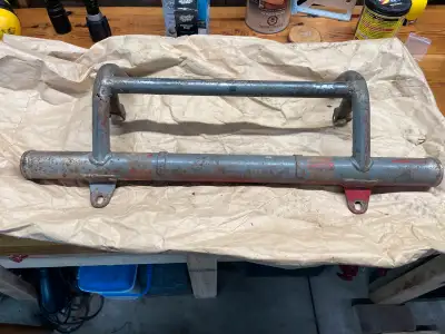 Bumper is straight but has some thin metal in one spot as shown in the pictures.