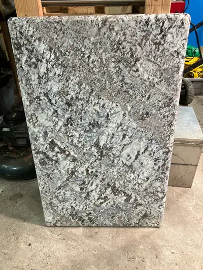This granite vanity top is ready to elevate your bathroom or kitchen with its unique blend of grey,...