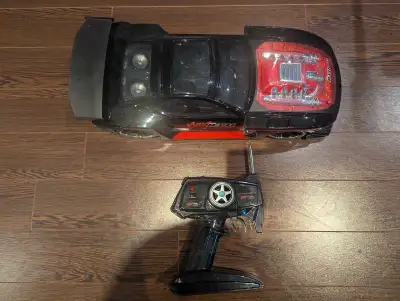 Selling a MaxTech Muscle Tuner R/C Car. This includes a 9.6V rechargable battery, Battery charger an...