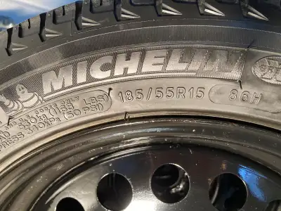 Michelin X Ice snow tires Four bolt steel rims VERY little use All are in very good to like new cond...