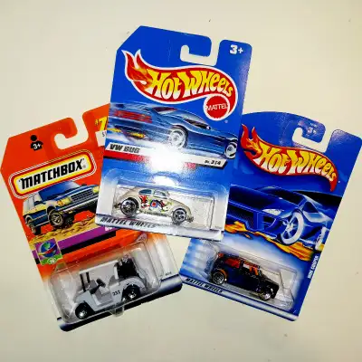 Lot of 3 die cast cars: - Hot Wheels VW Beetle Bug, card dated 1997. - MATCHBOX GOLF BUGGY, card dat...