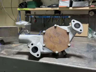 Aluminum high performance water pump (short) for big block Chev. Came on my 572 but never used.