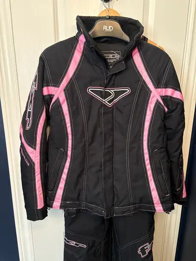 FXR women’s curve jacket and matching pants for snowmobiling. Sliming “curve” fit. Multiple inside a...