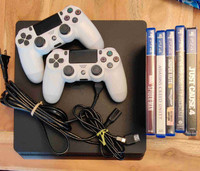 2TB Playstation 4 with 2 controllers and 5 games