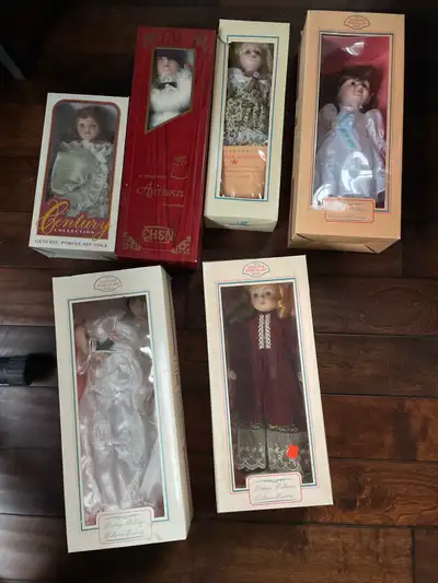 I am offering a collection of six vintage porcelain dolls, each still in its original packaging. The...