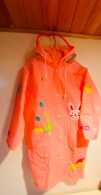 Girl raincoat with backpack cover