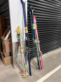 Five pairs of Skis with poles