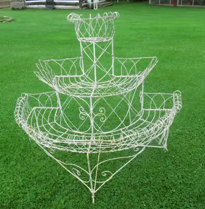 Antique real Victorian wire semi- circular plant stand measuring 43 inches wide 24 inches deep and 4...