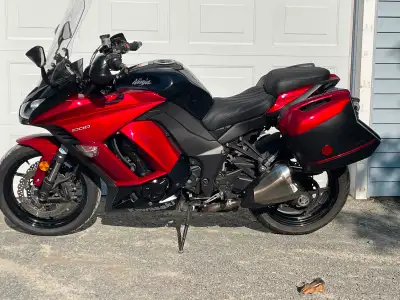 Selling my 2015 Kawasaki Ninja 1000 ABS Sport Touring Bike. Black and red. Has OEM Kawasaki hard bag...
