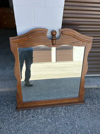 70$ 38 inch by 43 inch This is an used oak wood mirror with a carved top. It's suitable for a dresse...