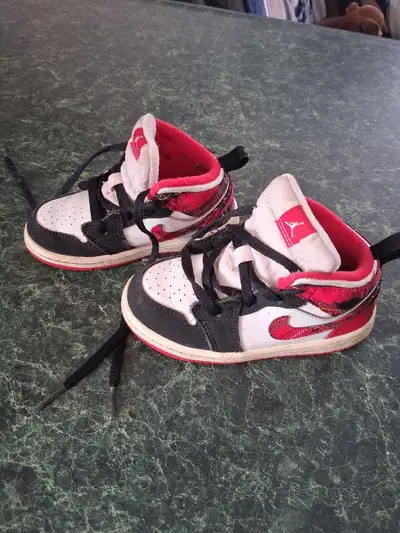 These are a pair of used toddler Jordan 1 shoes, size 8C. They are in fair condition. Perfect for yo...