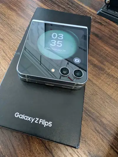 Mint green samsung z flip 5 for sale phone works, touch screens work. comes with box and a dbrand gr...