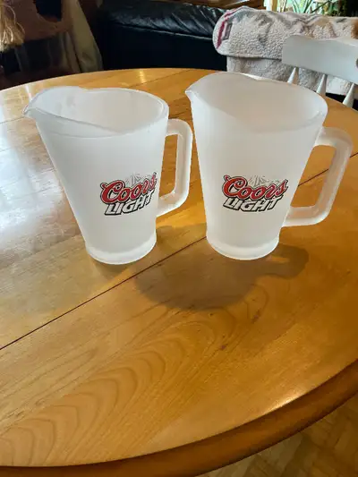 Selling a pair of glass pitchers coors light branded Asking $15 for the pair