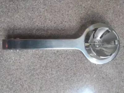 Egg measurer $5 Mushroom brush $6 Lemon juicer $6 3 peelers swiss $9 Group of scissors, peelers and...