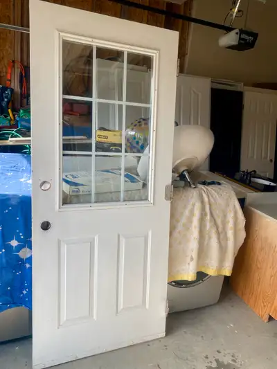 Exterior Metal insulated door 33.75”wide 79” height with double pane glass insert in good condition...