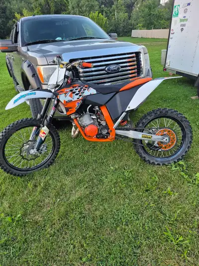 This used KTM 125cc motocross bike features a powerful two-stroke engine and is ready for the track....
